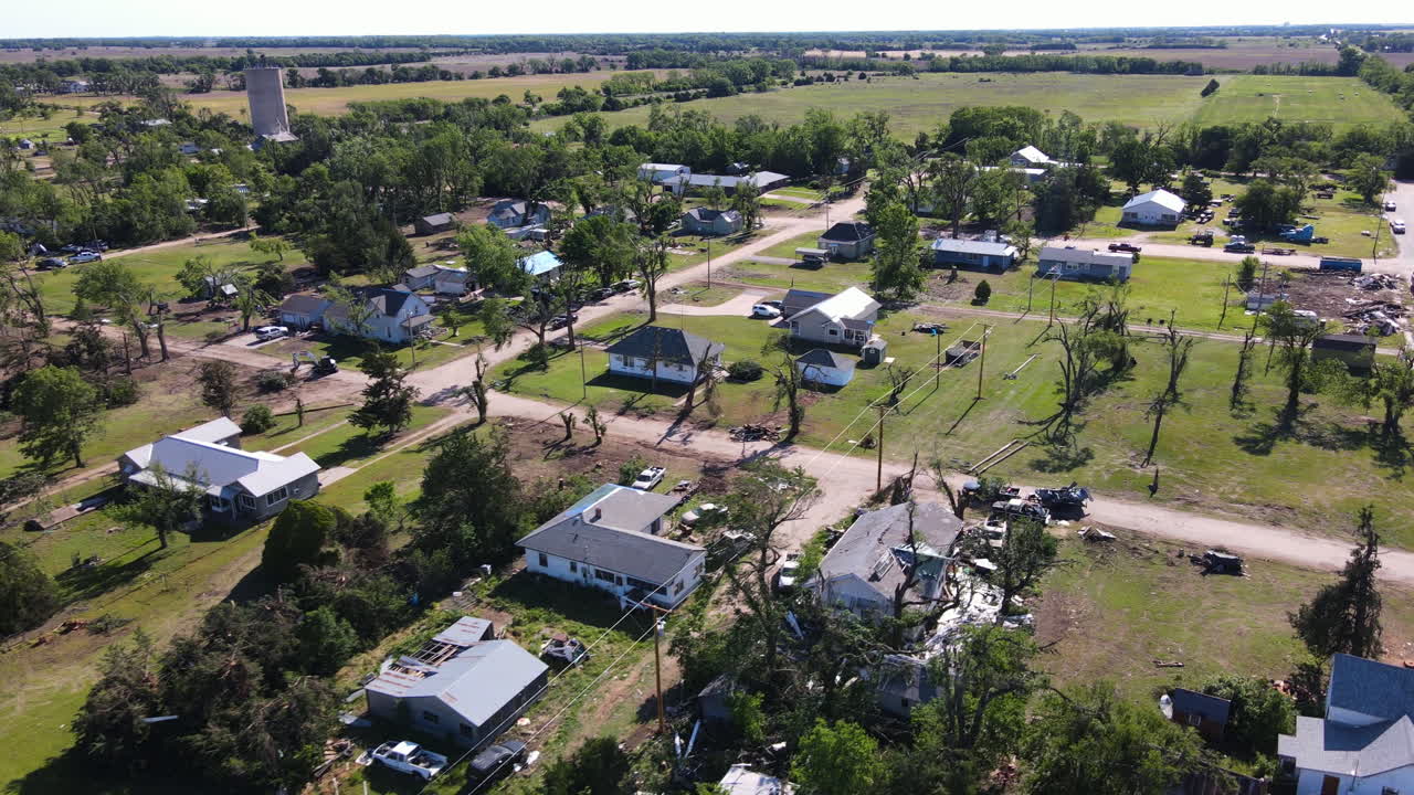 Aerial view over broken houses in a village, tornado aftermath in Kansas, USA