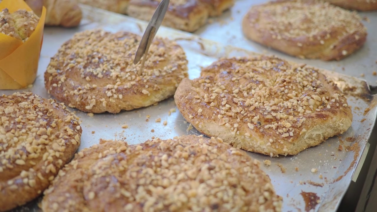 Freshly Baked Nut-Topped Pastries on a Bakery Tray