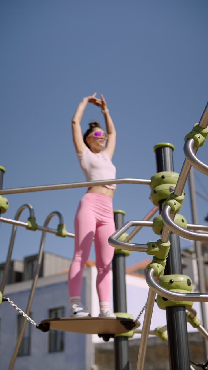 Woman Exercising on Outdoor Fitness Equipment