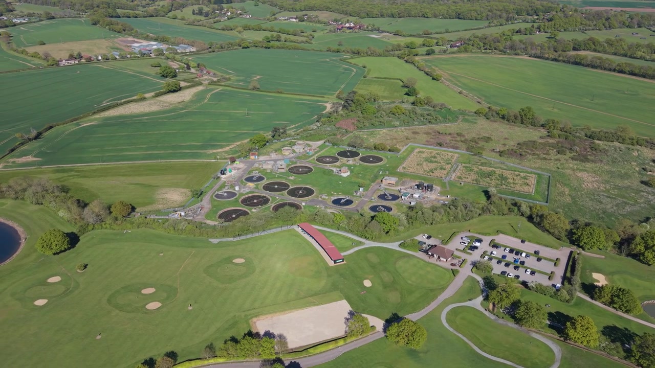 Daytime Aerial View of a Golf Course and Water Treatment Plant