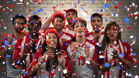 group of fans cheering for their team with confetti