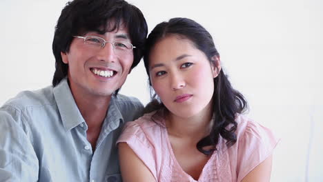 couple laughing as they sit together