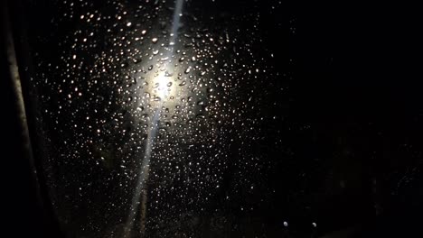 car glass in raindrops