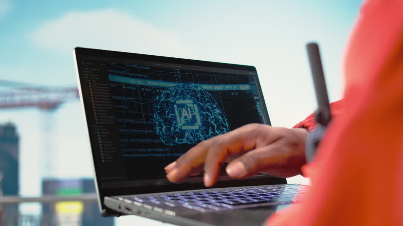 Vertical video Close up of offshore platform worker using AI on laptop
