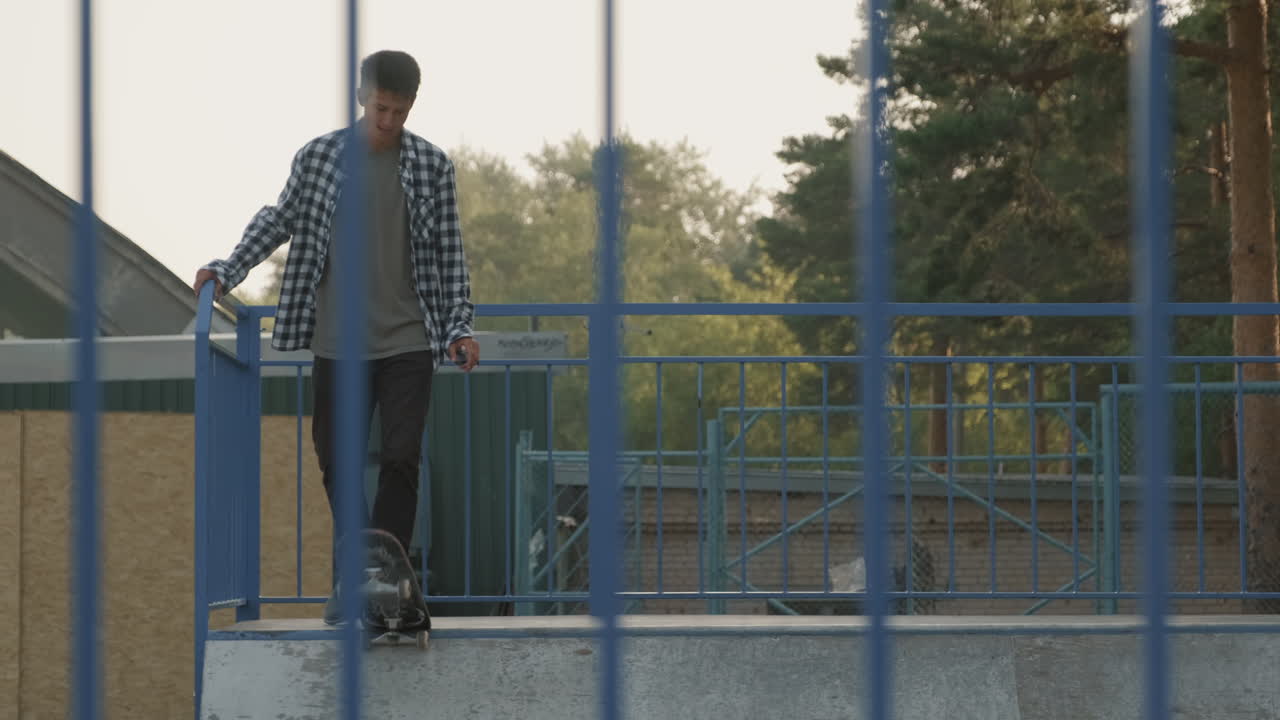 Skater Practicing on Ramp in Skatepark