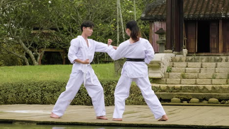 young couple fighting in class outdoors