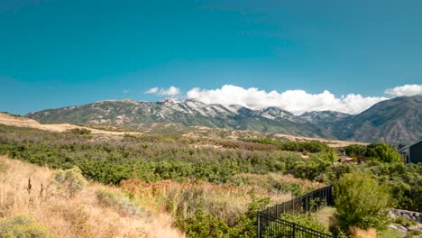 panoramic time lapse of cloud rolling over the rocky mountains near highland, utah