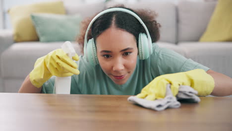 housekeeping, headphones and woman wipe the table