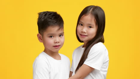 two children smiling at the camera