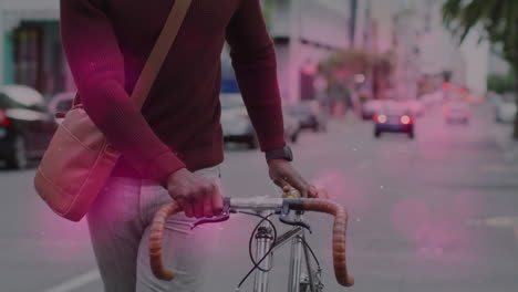 animation of shapes moving over senior african american man walking with bicycle