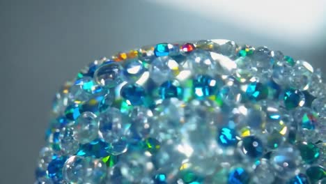 close-up view of a decorative glass item with colorful crystals