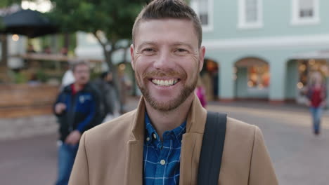 slow motion portrait of charming caucasian man laughing happy in urban background