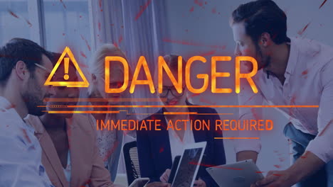 danger warning text animation over business meeting with diverse professionals