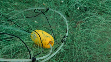 fishing industry, plastic contamination of the ocean, fishing net on the beach