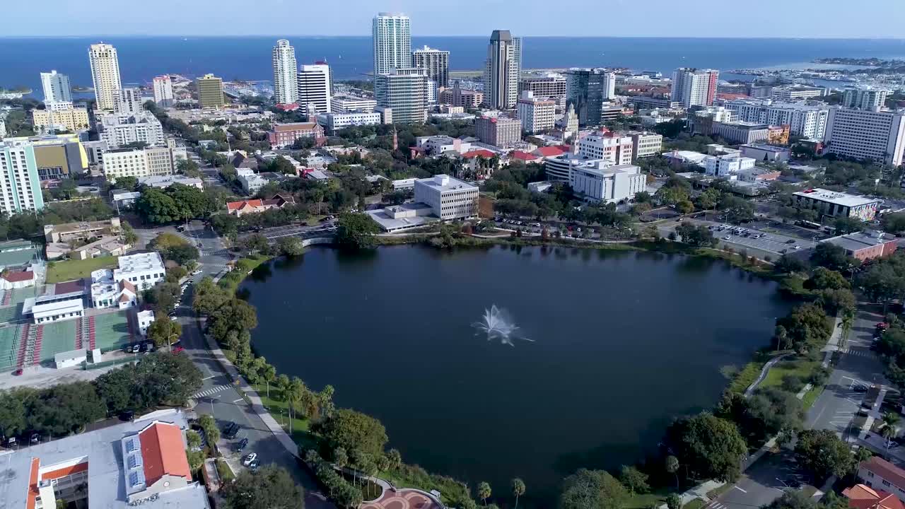 4K Aerial Video of Downtown St Petersburg, Florida from Mirror Lake - Tilt Up from Fountain