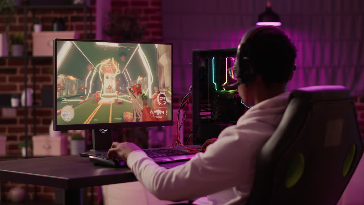 Over shoulder view of african american gamer celebrating after winning online competition