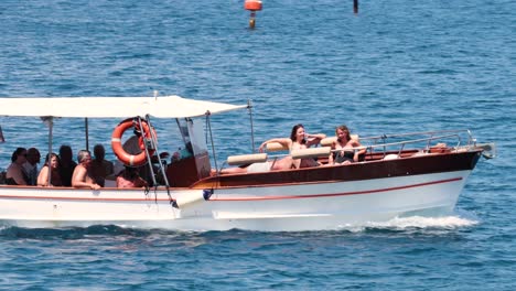 tourists enjoying a boat ride in sorrento