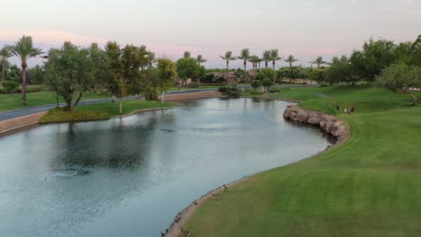 A-drone-glides-over-a-pond-on-a-sunny-afternoon