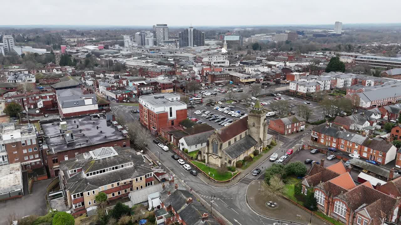 Basingstoke town centre England pull back drone aerial reverse reveal
