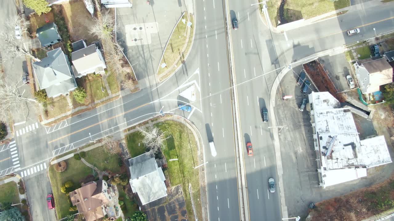 aerial of cars driving on highway through Plainfield, New Jersey in the winter