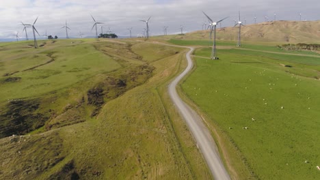 An-aerial-fly-in-to-an-active-wind-farm