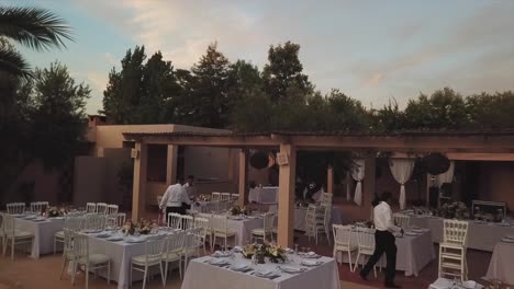 wedding planner making arrangements for poolside wedding at olivier marrakech hotel in morocco.