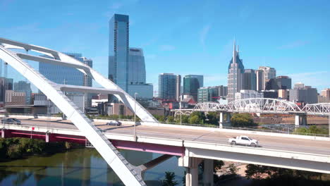 Korean-Veterans-BLVD-bridge,-drone-overlooking-downtown-Nashville,-Tennessee