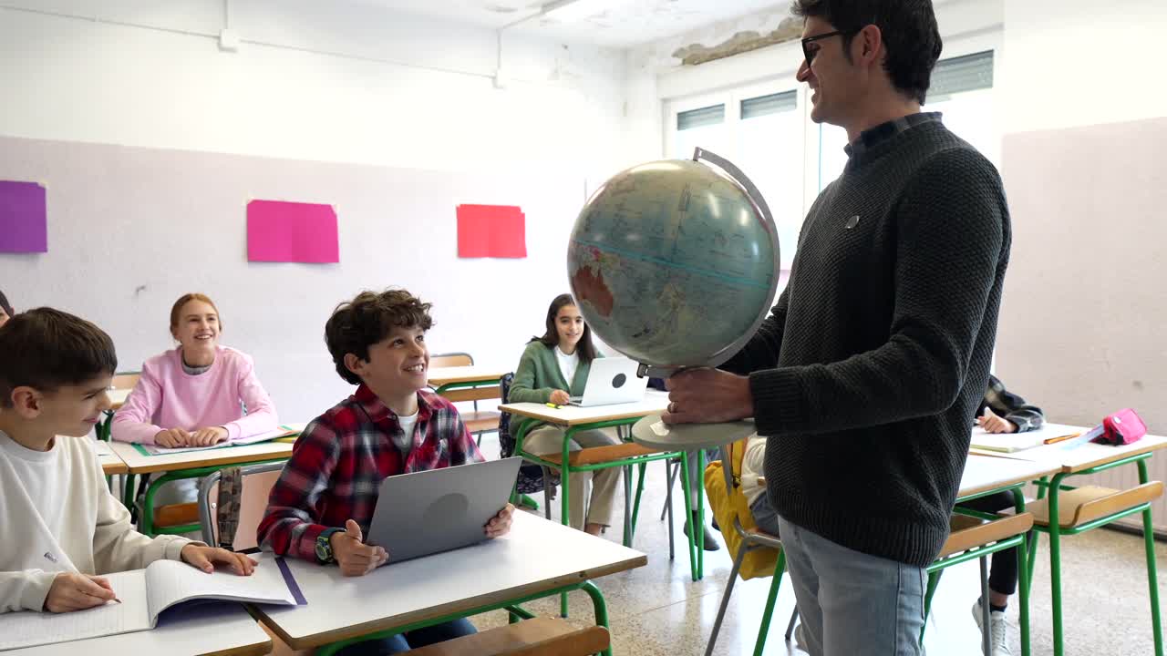 Teacher explaining geography to students in a classroom
