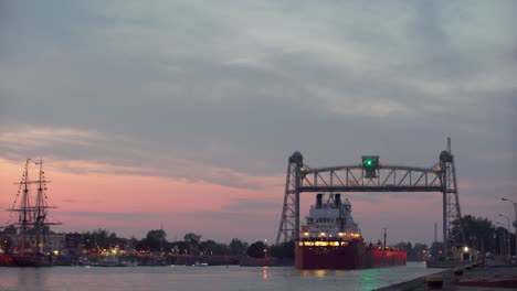 Lake-Freighter-traveling-under-lift-bridge-in-Port-Colborne