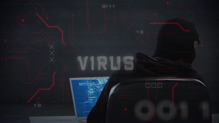 Hacker in dark room with computer, virus alert animation over binary code