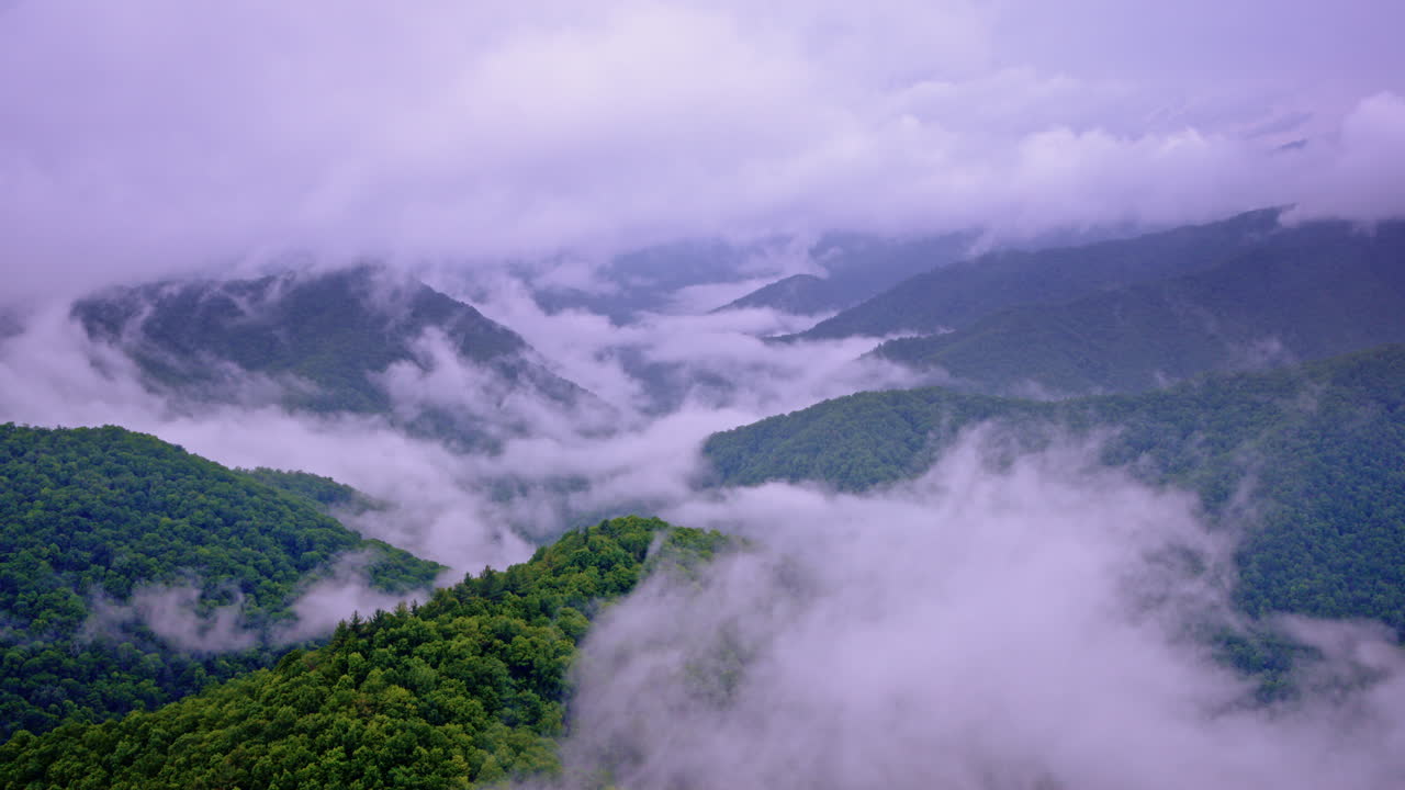 Aerial cinematic pass through a foggy Smoky Mountain morning