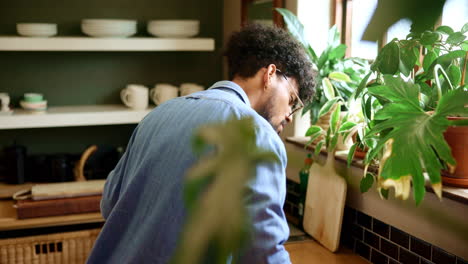 man cleaning dishes in a kitchen