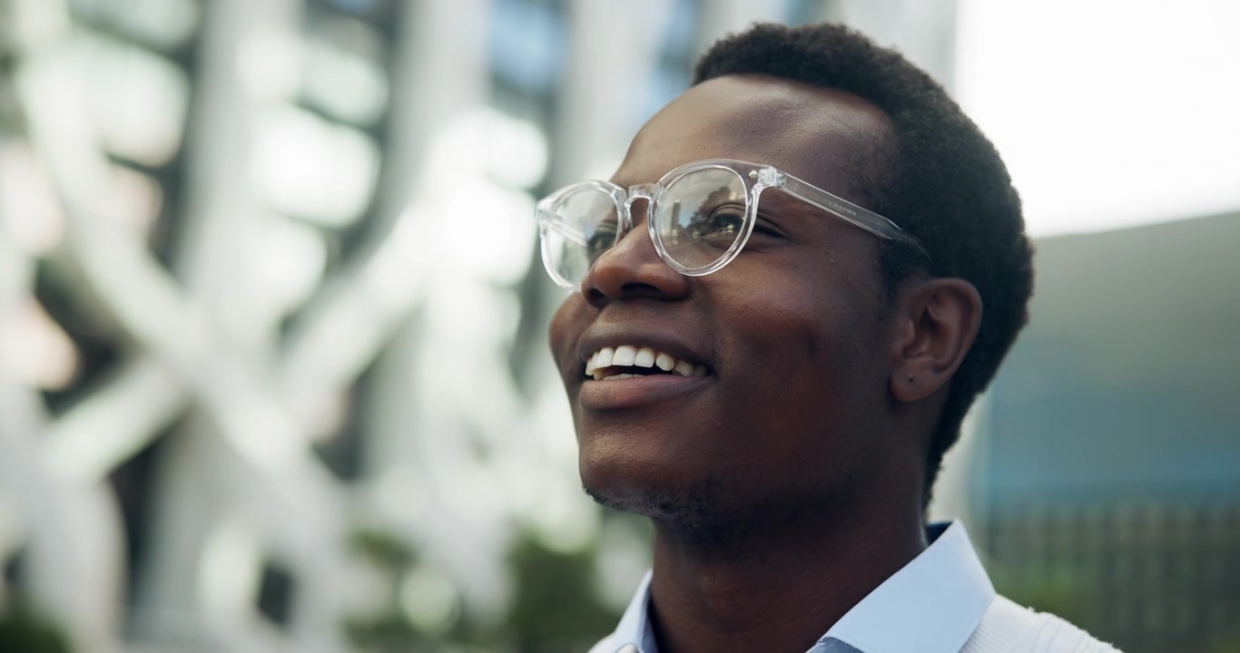 Young African American Man Smiling Outdoors in City