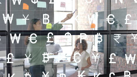 Animation-of-currency-icons-over-diverse-business-people-discussing-work-in-office