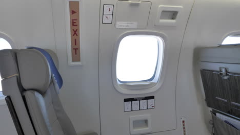 emergency exit -inside an airplane during travel -tilt up