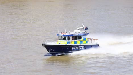 police boat speeding on the thames river