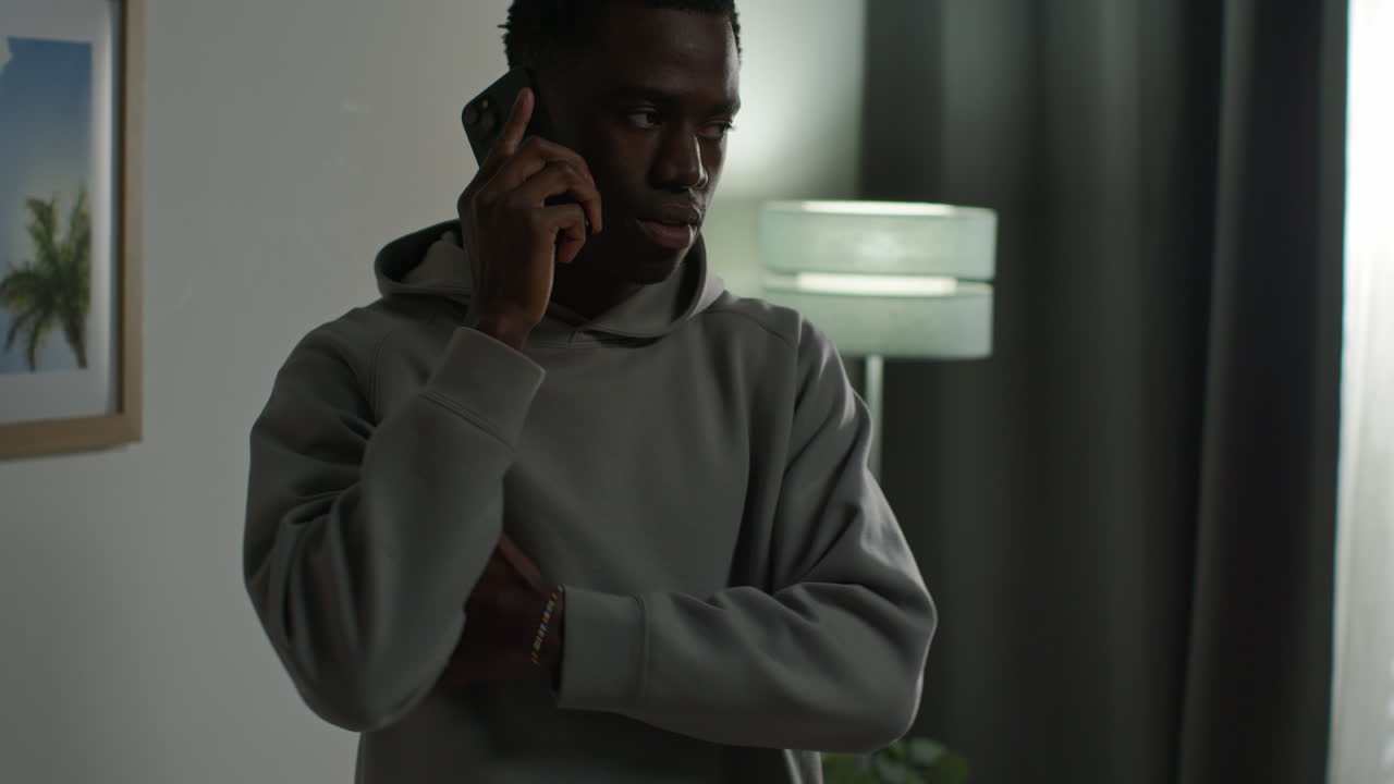 Close Up Of Young Man At Home Talking On Mobile Phone Reacting And Looking Upset After Getting Bad News 4