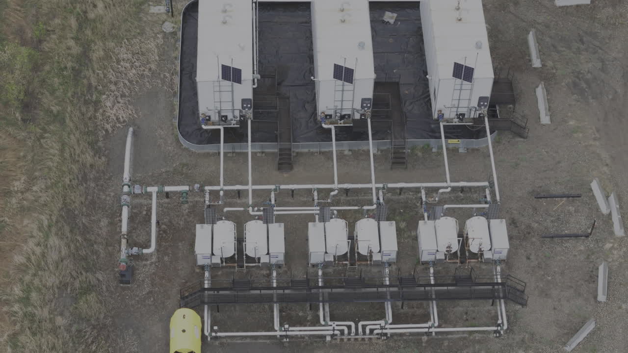 Comprehensive drone footage displaying the layout of pipelines and storage tanks in British Columbia's energy sector.