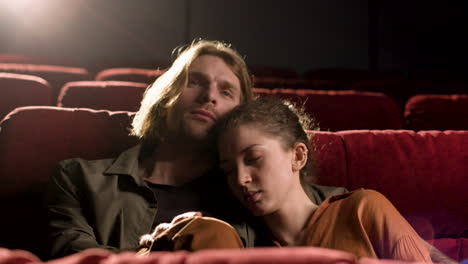 couple sitting in the cinema watching a movie