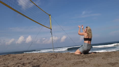 girl playing beach volleyball.