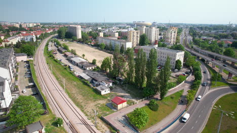 Aerial-reveal-of-Gdansk-busy-city-street-with-a-maze-of-roads-and-overpasses-with-cars-traffic-on-Wezel-Kliniczna-street-in-summer