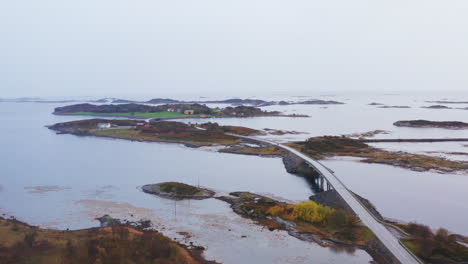 atlantic ocean road and norwegian sea on a misty morning with rocky islands in norway