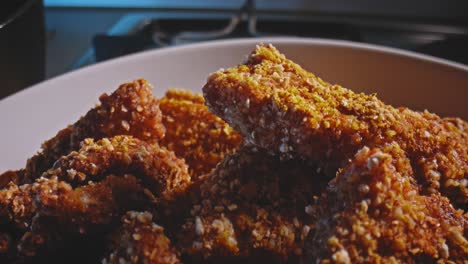 closeup bowl of homemade organic tasty crispy chicken nuggets ready to eat