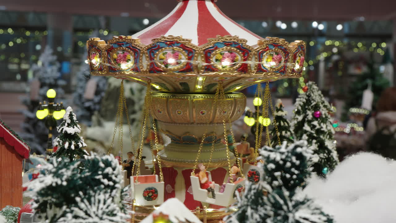 Miniature Christmas Carousel Rotating in a Festive Holiday Display