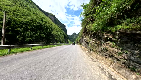 ha giang loop, northern vietnam, asia - cruising along the scenic road on a scooter - pov