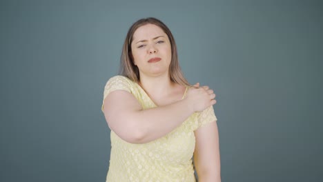 young woman with shoulder pain.