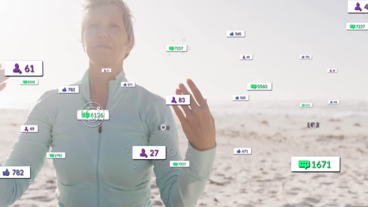 Animation of social media notifications, over happy woman doing yoga on beach