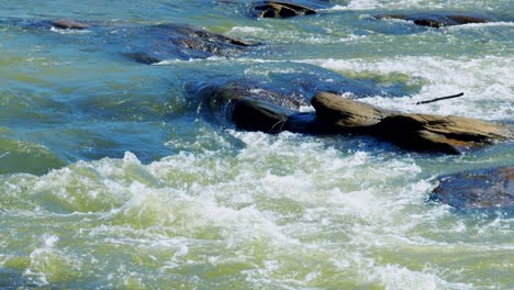 slow motion rapids with rocks