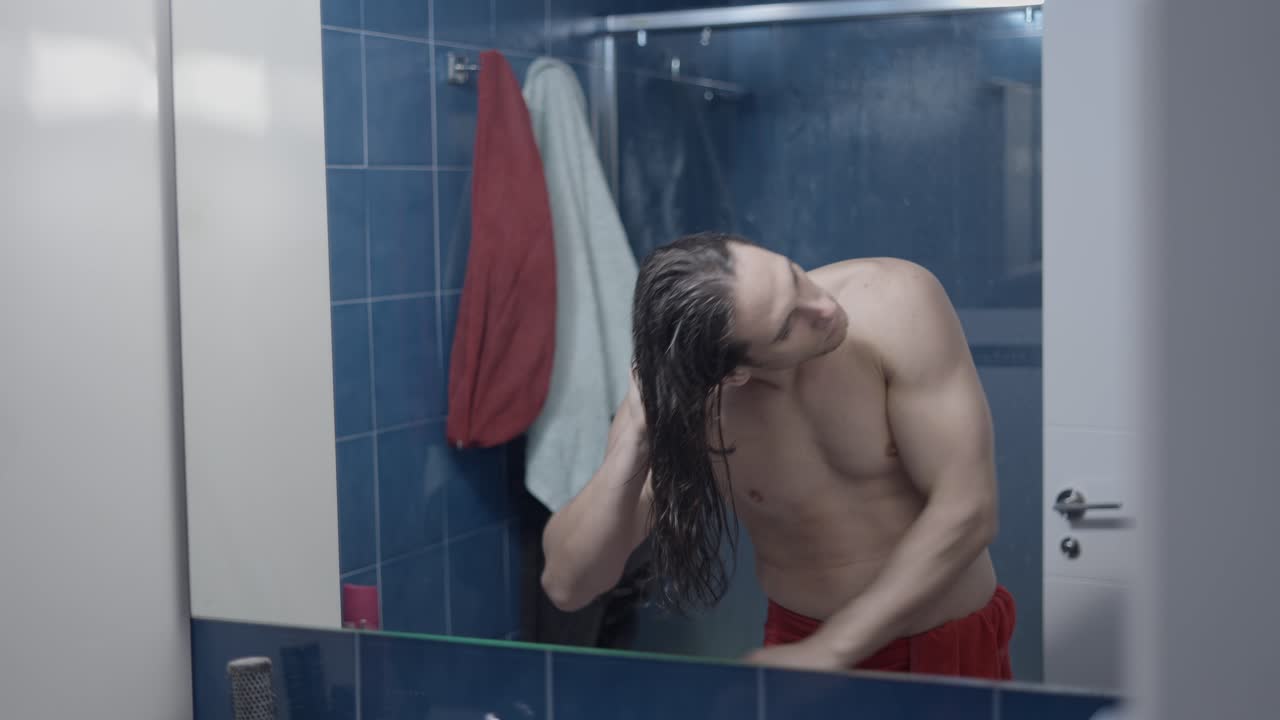 Man getting ready in bathroom