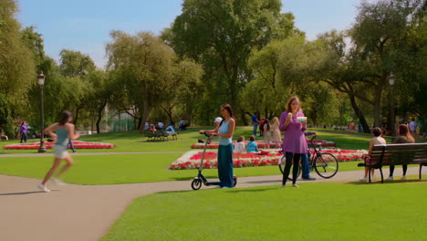 people enjoying various activities in a vibrant public park